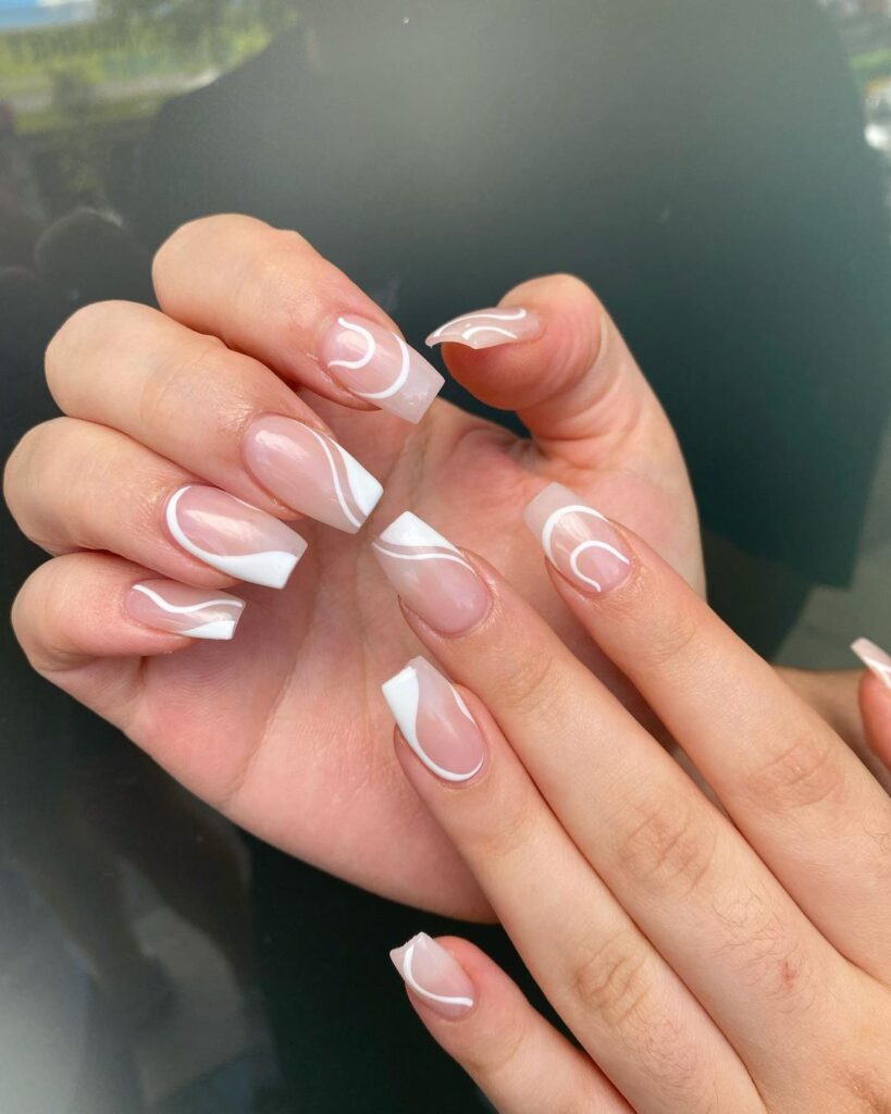 Nude and White Swirls Nails
